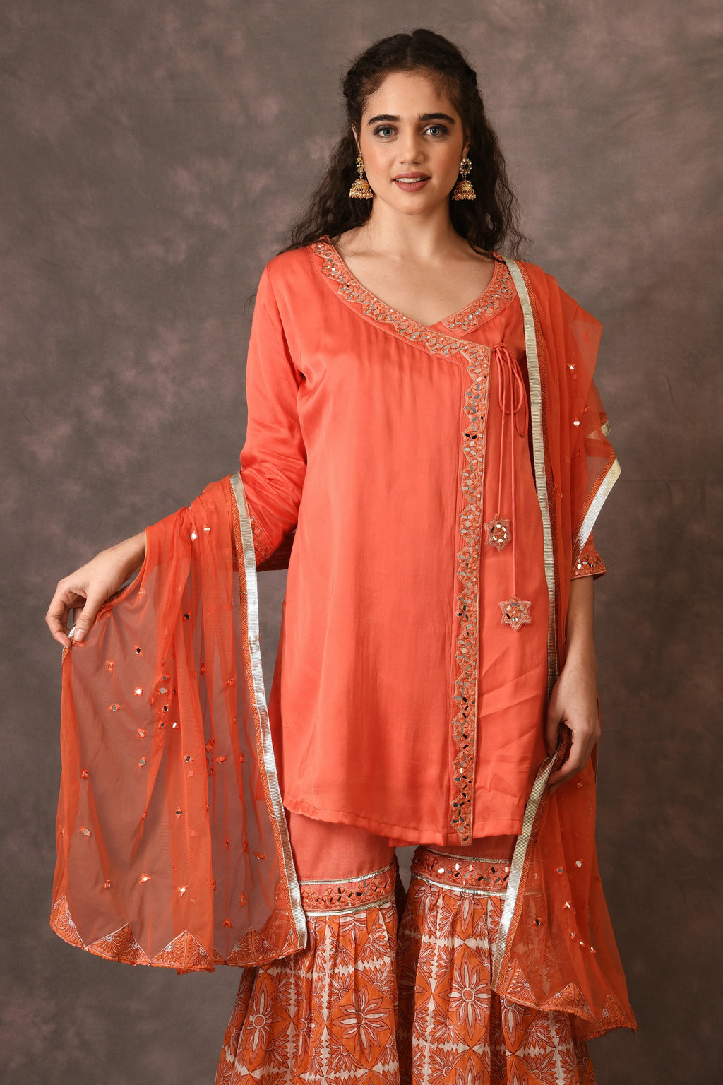 Orange Flame Angarkha And Sharara Set With Mirror Embroidery And Handblock Printed Temple Flower Moti