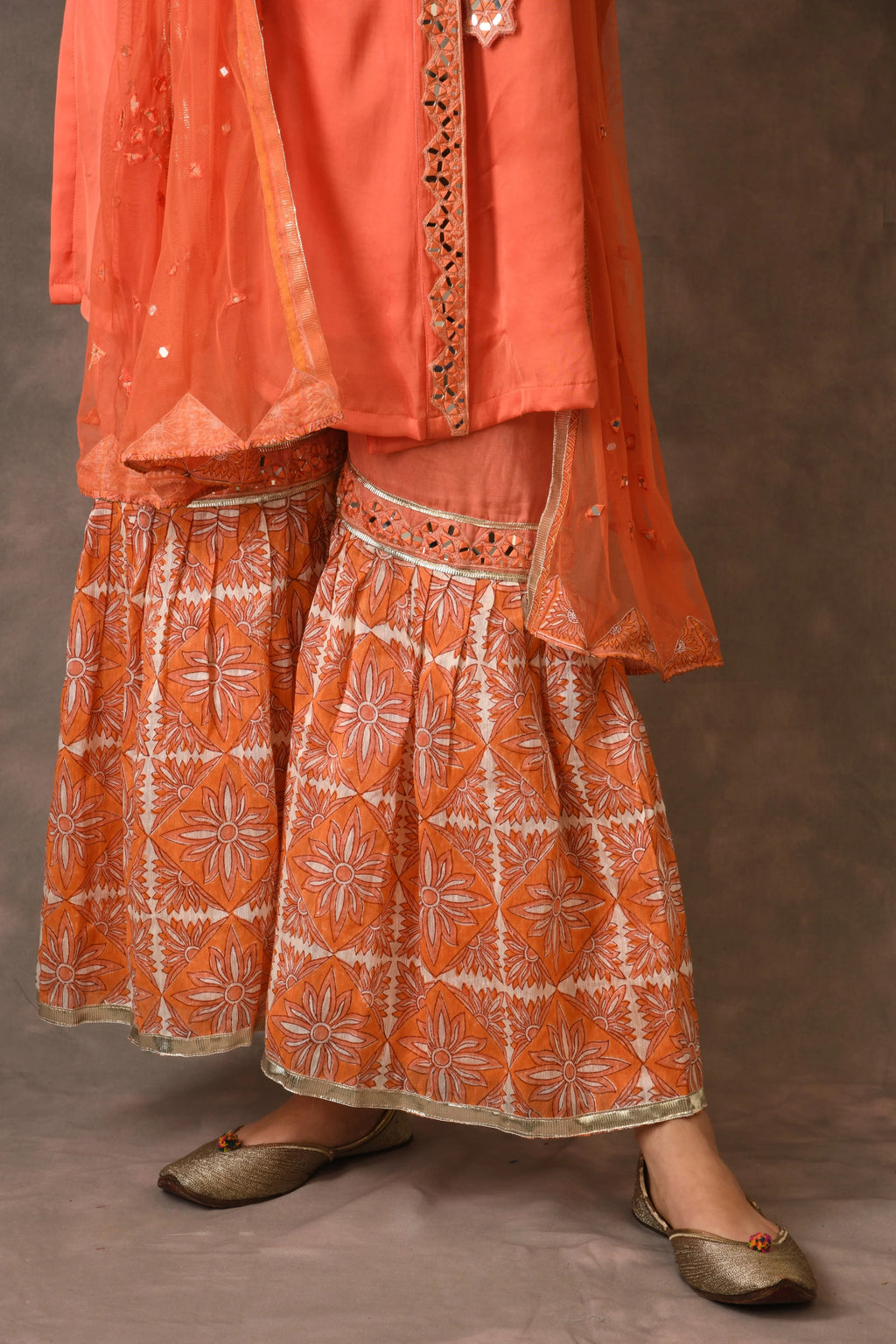 Orange Flame Angarkha And Sharara Set With Mirror Embroidery And Handblock Printed Temple Flower Moti