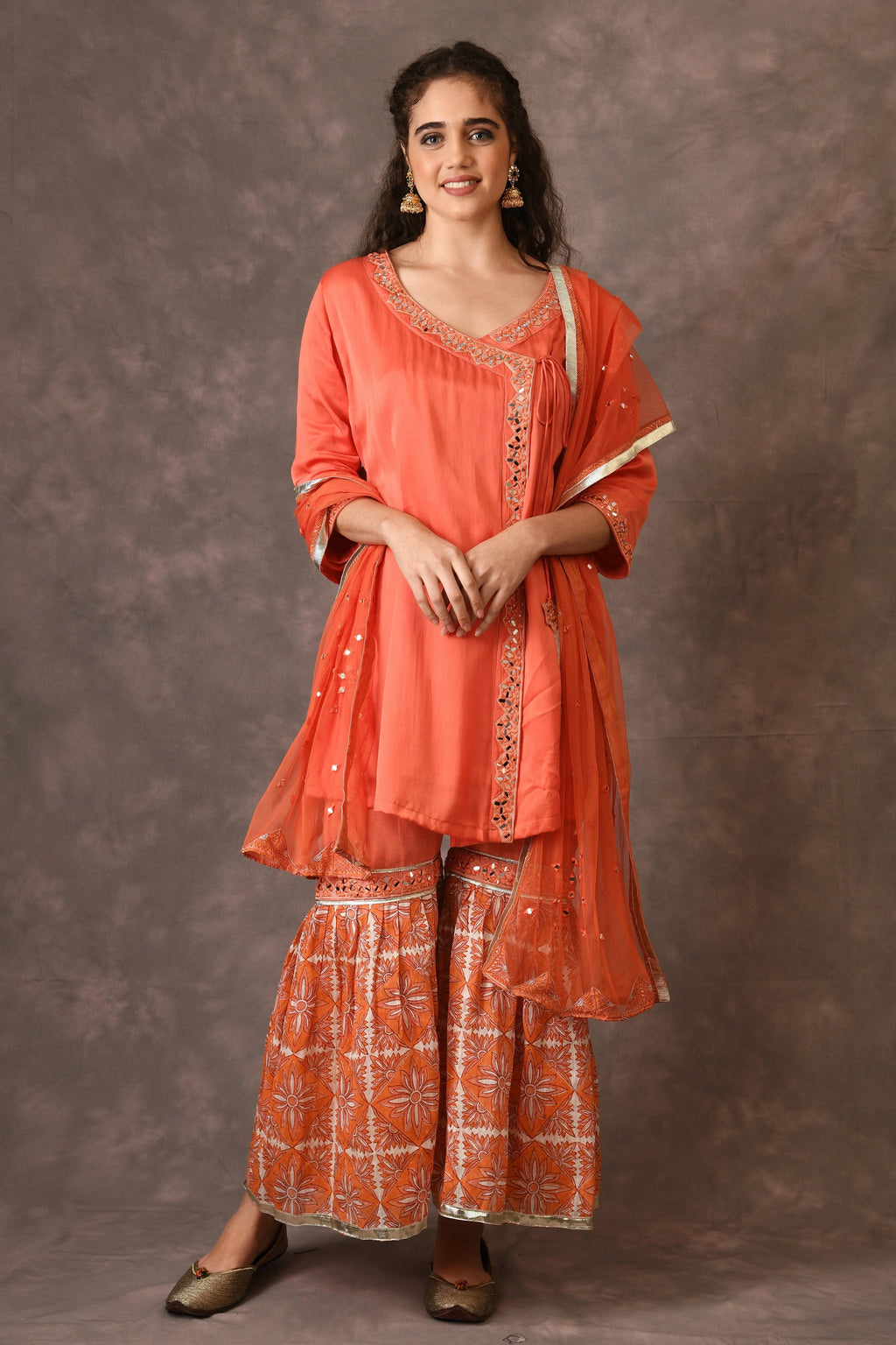 Orange Flame Angarkha And Sharara Set With Mirror Embroidery And Handblock Printed Temple Flower Moti