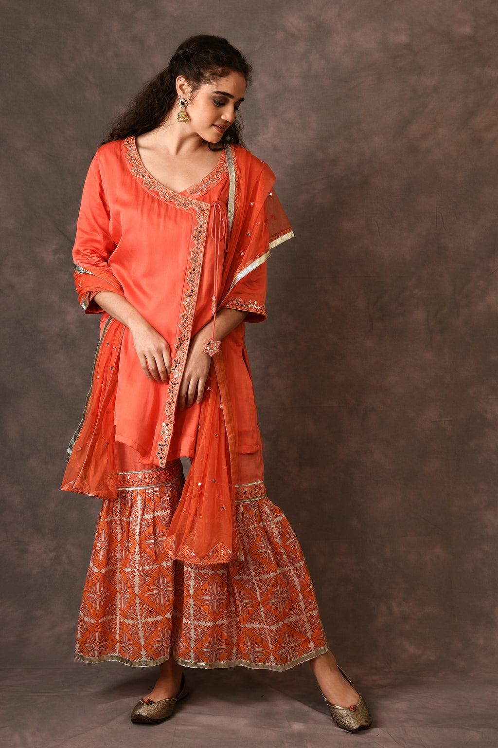Orange Flame Angarkha And Sharara Set With Mirror Embroidery And Handblock Printed Temple Flower Moti